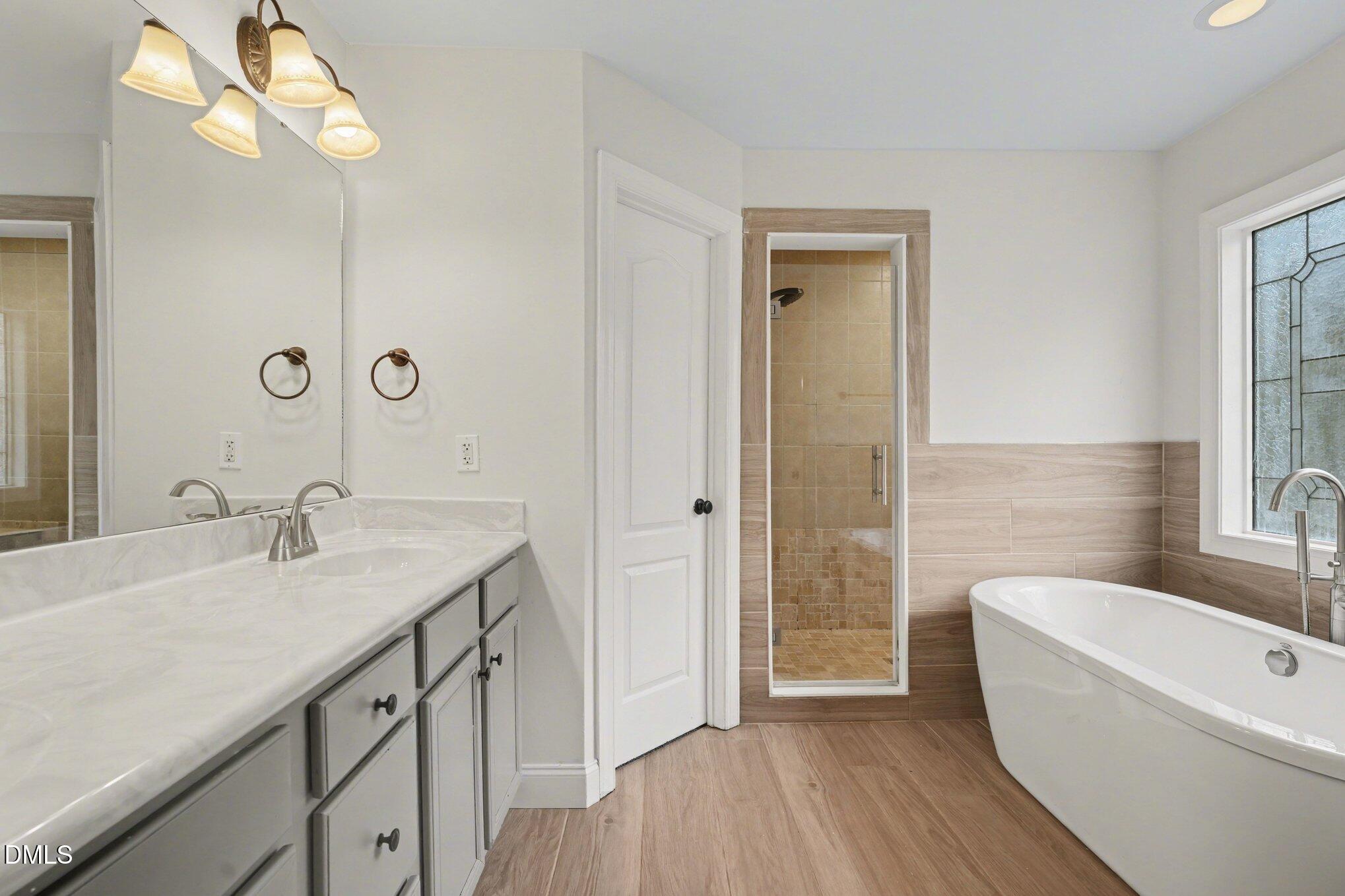 7250 Sandcastle Lane Linden, NC 28356 - Photo 10 of 20 a bathroom with a granite countertop sink a toilet and bathtub
