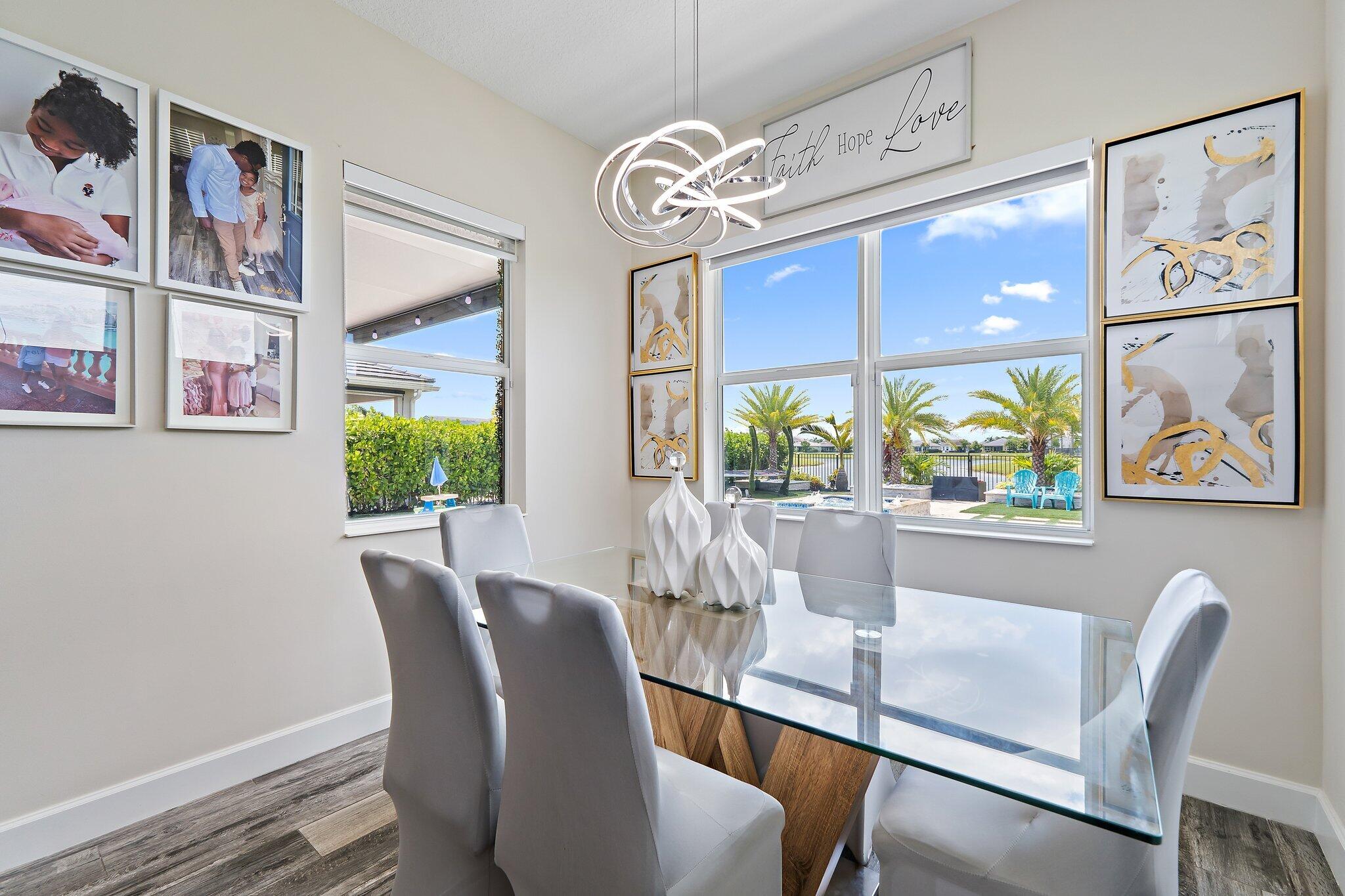 15834 Hummingbird Lane Westlake, FL 33470 - Photo 19 of 61 a dining room with furniture and window