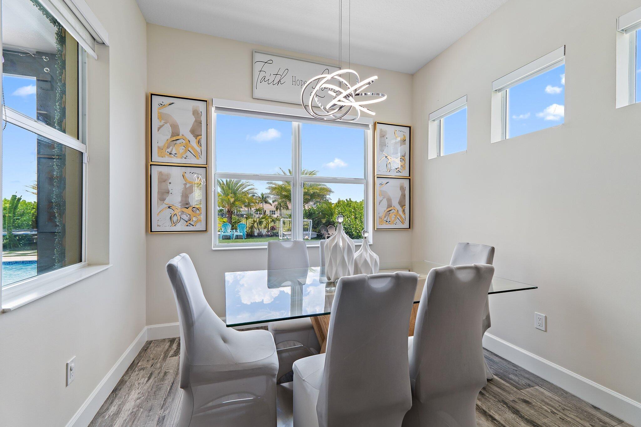 15834 Hummingbird Lane Westlake, FL 33470 - Photo 20 of 61 a view of a dining room with furniture window and outside view