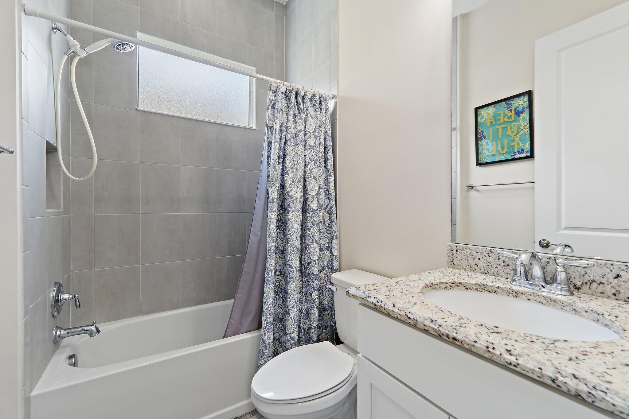 15834 Hummingbird Lane Westlake, FL 33470 - Photo 24 of 61 a bathroom with a granite countertop sink toilet and shower