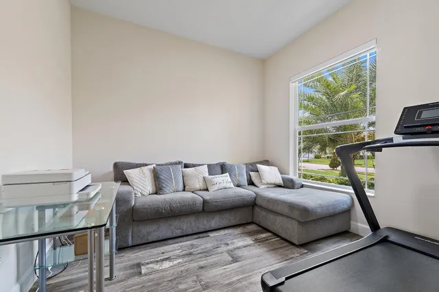 a view of a dining room with furniture window and outside view