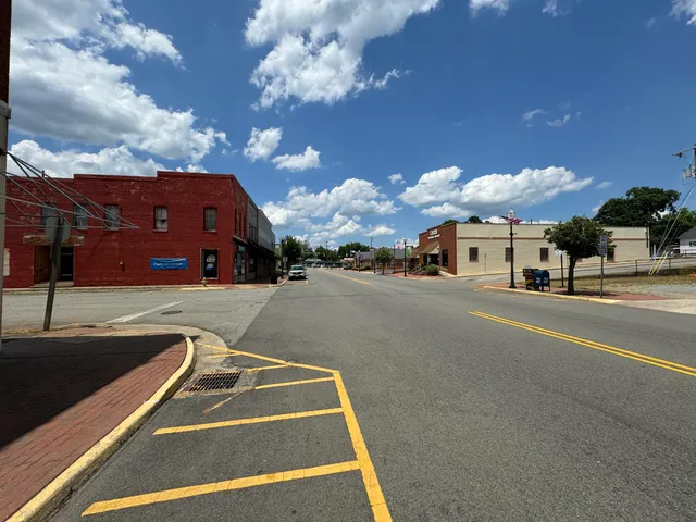 a view of a building with a yard