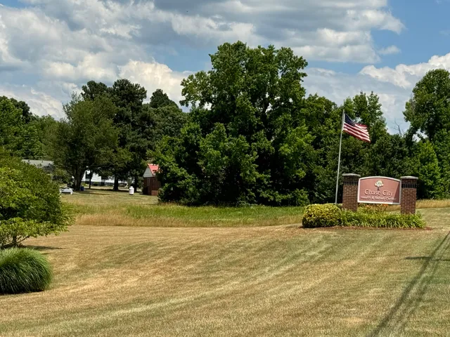 a view of a swimming pool with an outdoor space and seating area