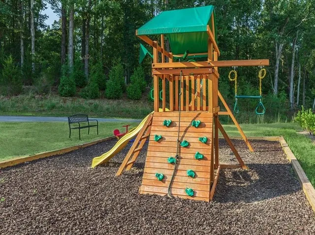 a view of a park with a wooden deck
