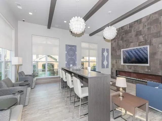 a large kitchen with a table and chairs