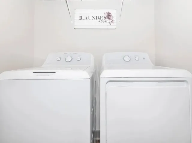 a utility room with dryer and washer