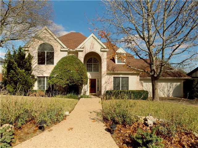 5702 Barker Ridge Drive Austin, TX 78759 - Photo 1 of 1 a front view of a house with a yard