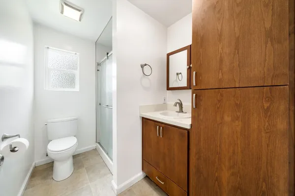 an entryway with fireplace and wooden floor