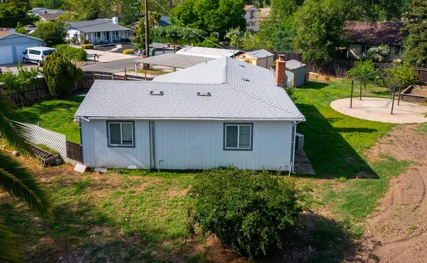 a aerial view of a house with a yard