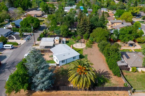 an aerial view of a house with swimming pool