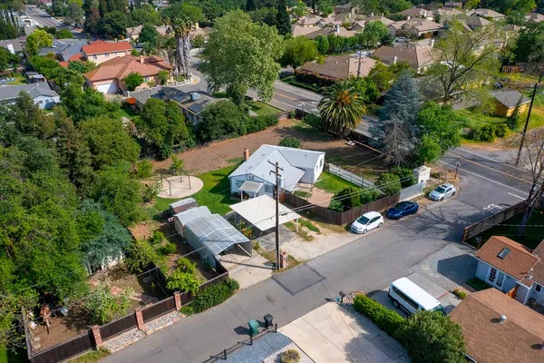 an aerial view of residential houses with outdoor space