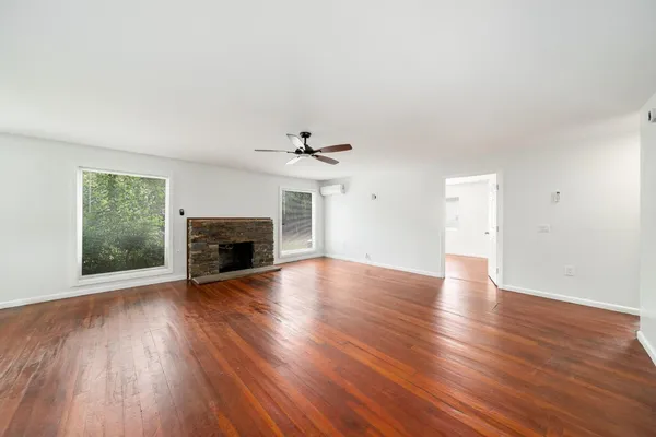 a view of kitchen and livingroom with wooden floor