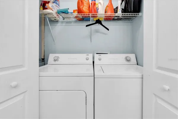 a utility room with dryer and washer