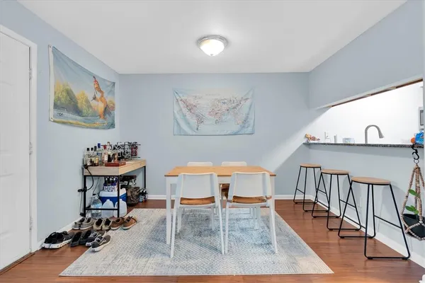 a view of a livingroom with furniture and lounge chair