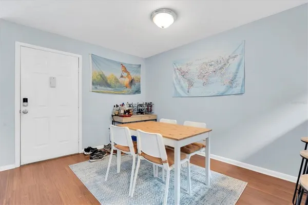 a view of a dining room with furniture and wooden floor