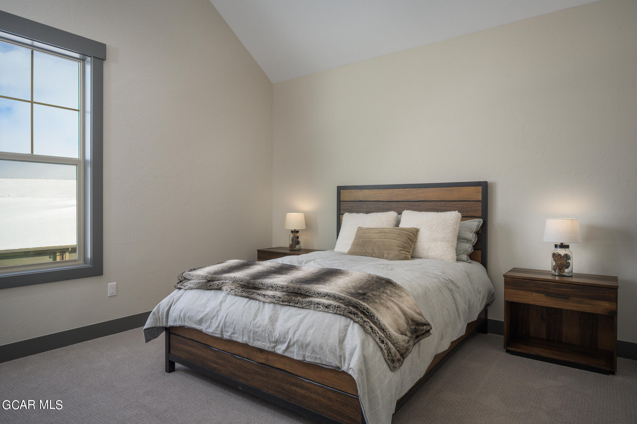 142 Eagle Ridge Drive Granby, CO 80446 - Photo 4 of 5 a bedroom with a bed and window