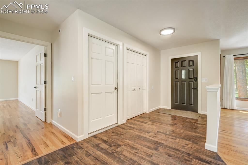 8950 Pine Cone Road Colorado Springs, CO 80908 - Photo 4 of 47 a view of a livingroom with wooden floor and closet area