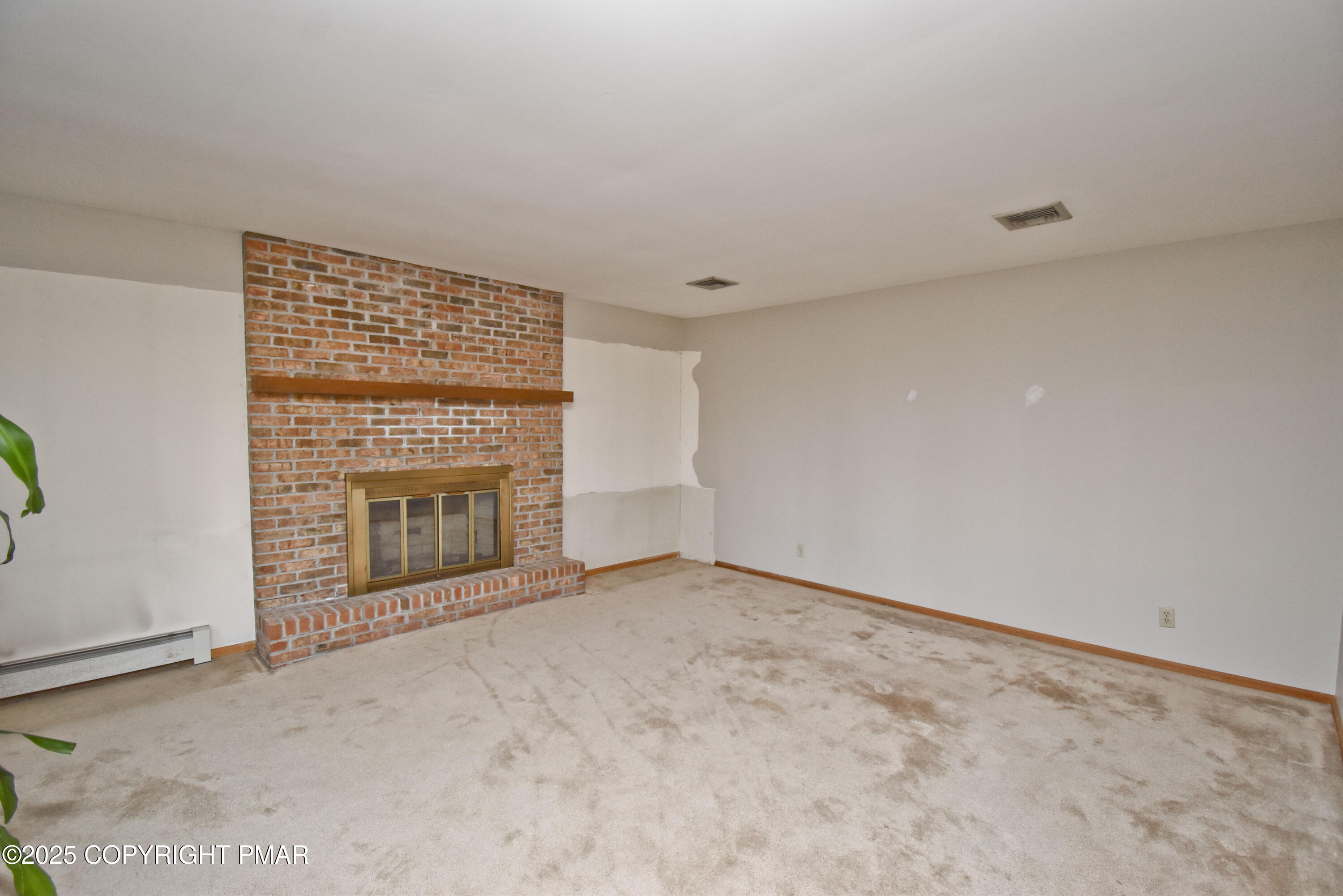 5294 Cherry Valley Road Saylorsburg, PA 18353 - Photo 22 of 53 an empty room with a fireplace