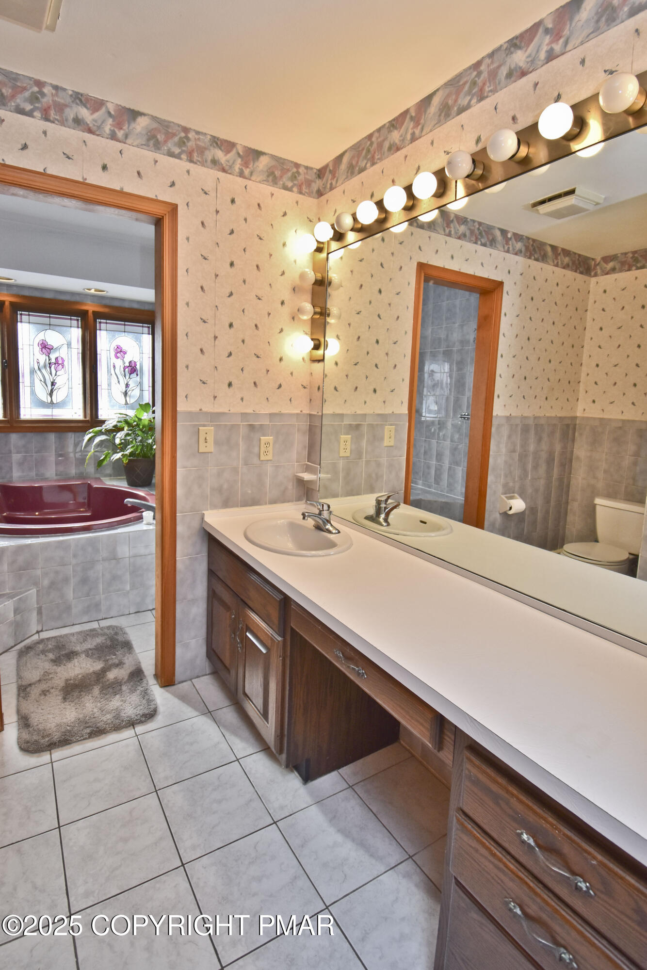 5294 Cherry Valley Road Saylorsburg, PA 18353 - Photo 30 of 53 a bathroom with a sink a vanity and a mirror