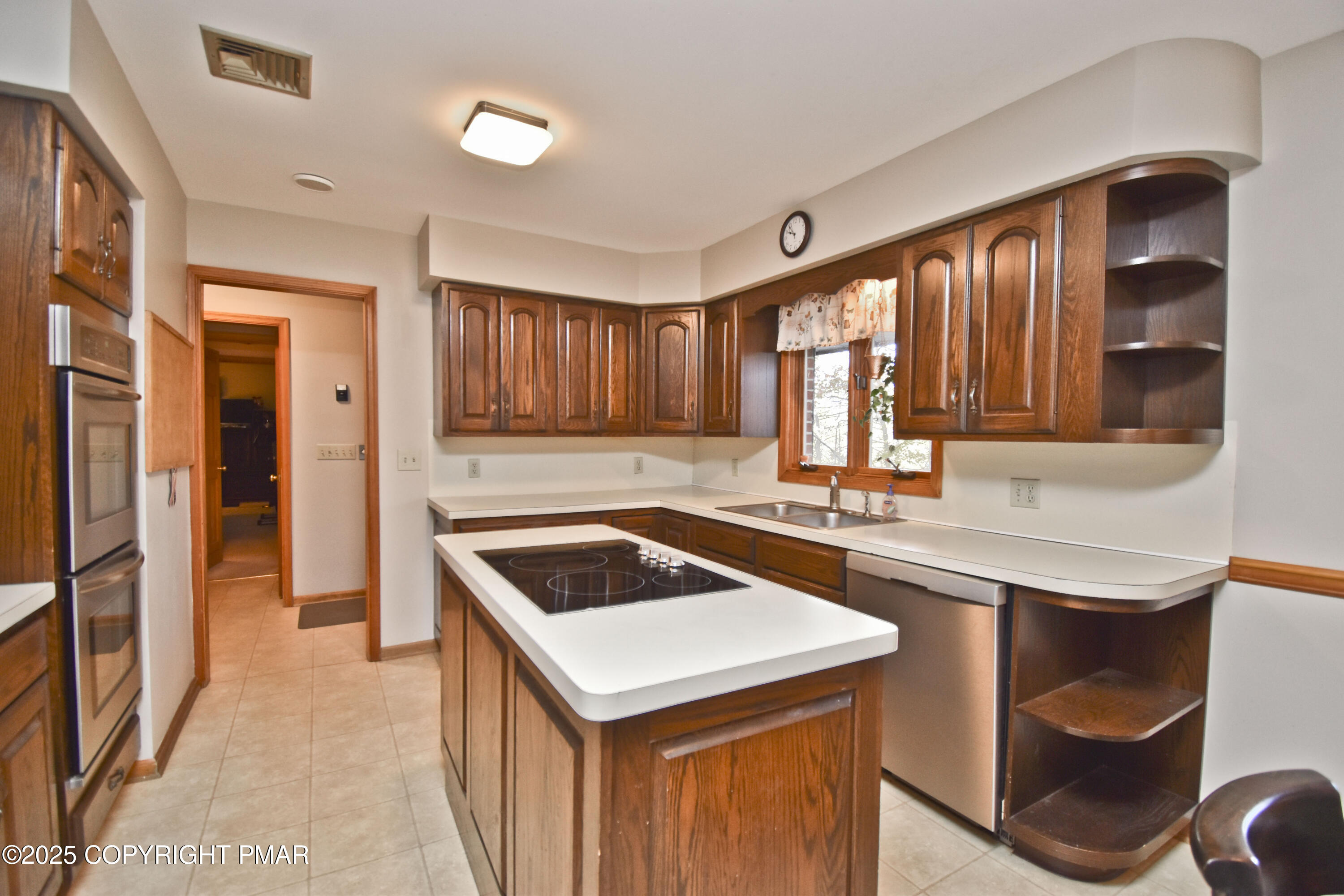 5294 Cherry Valley Road Saylorsburg, PA 18353 - Photo 4 of 53 a kitchen that has a sink a stove and a wooden cabinets