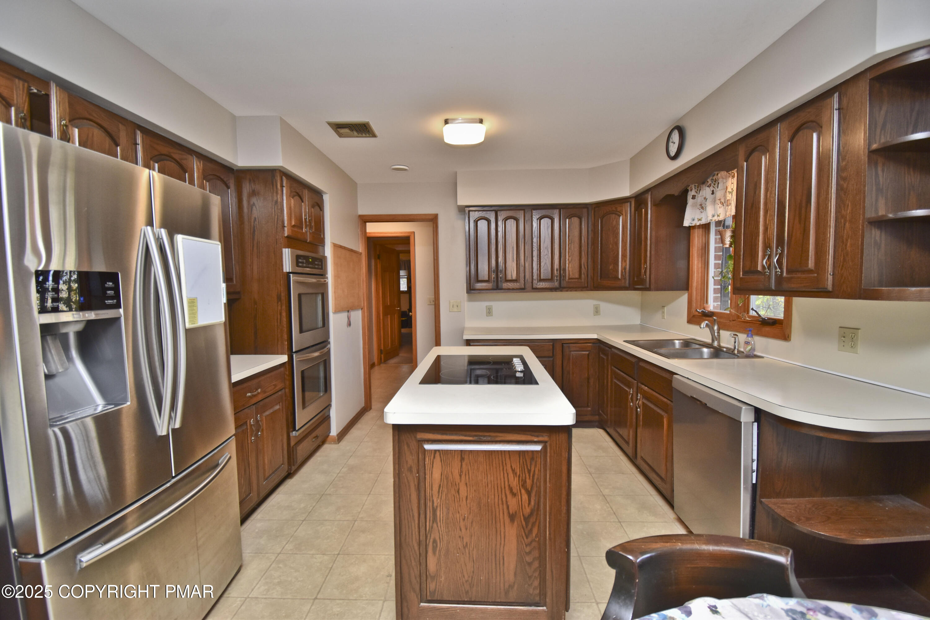 5294 Cherry Valley Road Saylorsburg, PA 18353 - Photo 5 of 53 a kitchen with stainless steel appliances granite countertop a sink refrigerator and cabinets