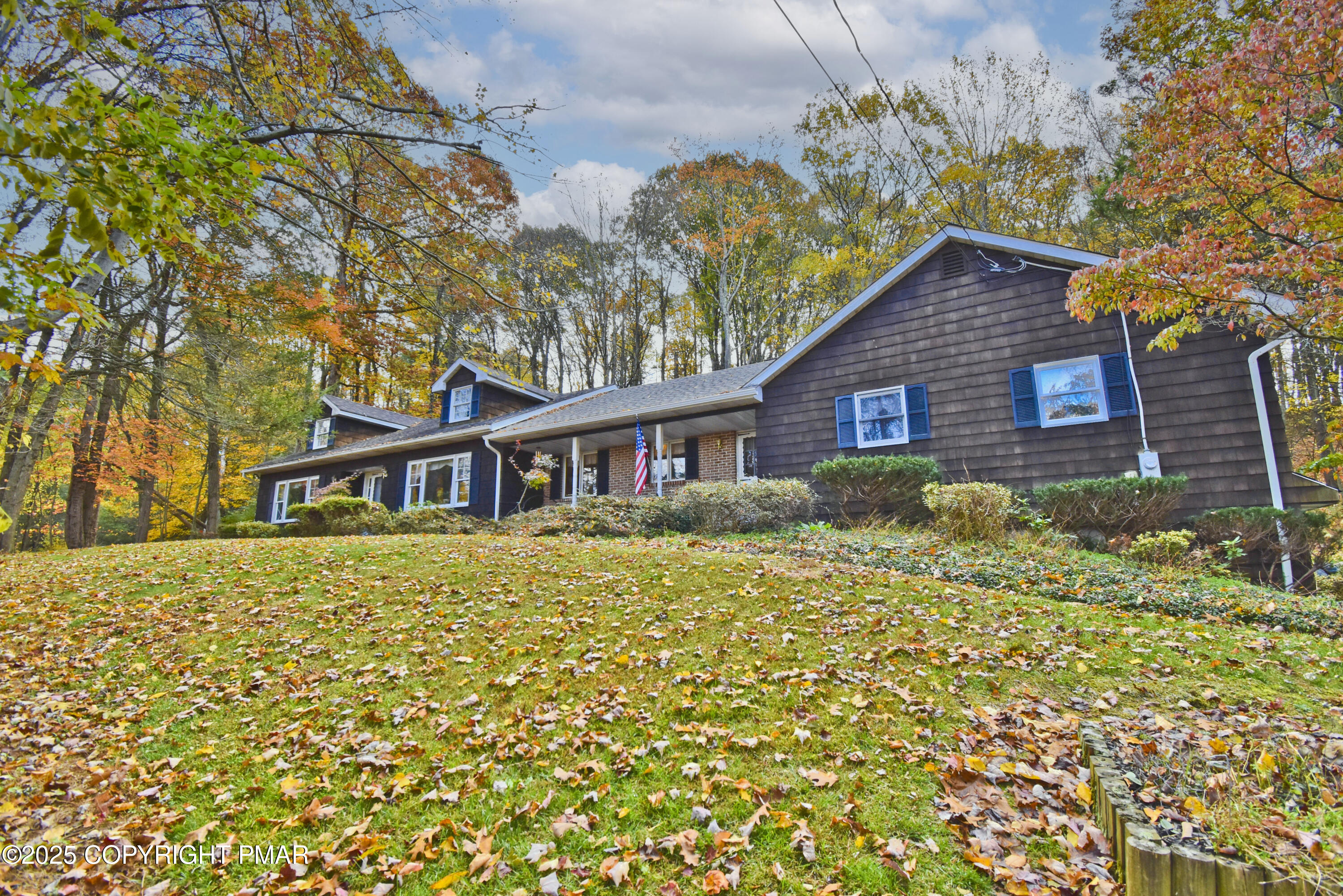5294 Cherry Valley Road Saylorsburg, PA 18353 - Photo 48 of 53 a brick house with a large tree in front of it
