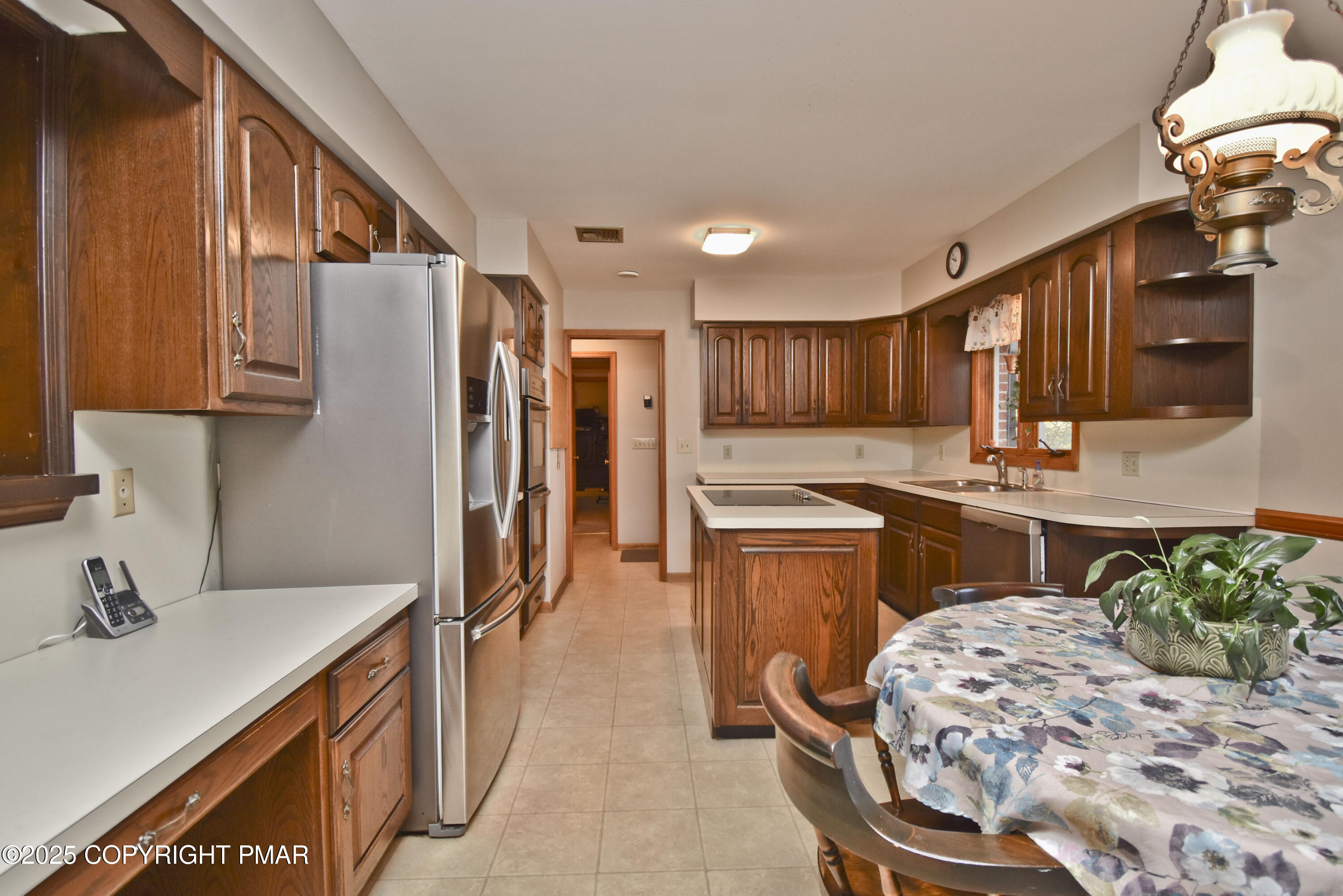 5294 Cherry Valley Road Saylorsburg, PA 18353 - Photo 9 of 53 a kitchen with a sink refrigerator and cabinets