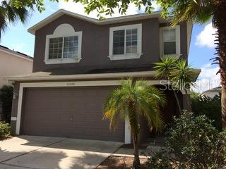 15308 Torpoint Road Winter Garden, FL 34787 - Photo 1 of 1 a front view of house with yard and green space