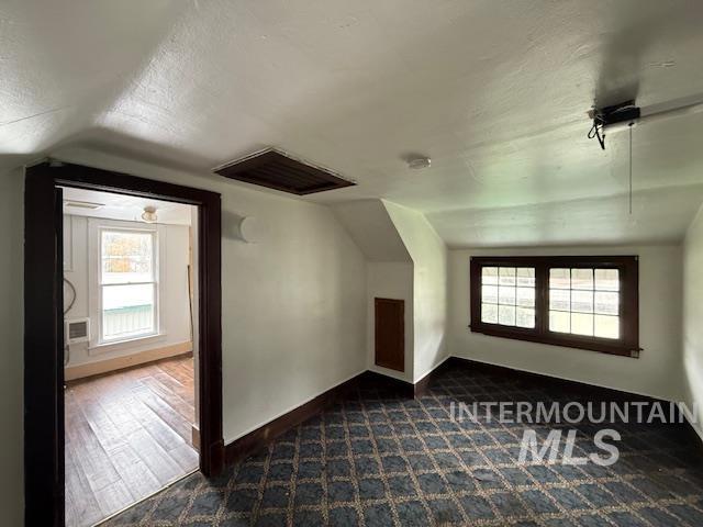 204 Front Street Kooskia, ID 83539 - Photo 14 of 25 Bonus room with vaulted ceiling, a textured ceiling, and healthy amount of natural light