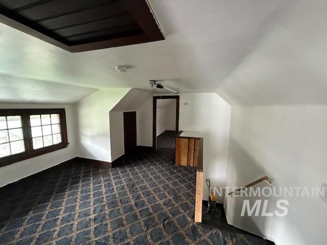 204 Front Street Kooskia, ID 83539 - Photo 15 of 25 Bonus room featuring dark colored carpet and lofted ceiling