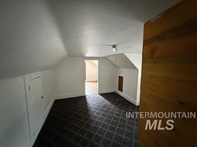 204 Front Street Kooskia, ID 83539 - Photo 16 of 25 Bonus room featuring vaulted ceiling and baseboards