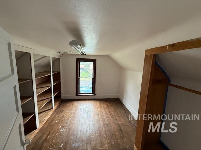 204 Front Street Kooskia, ID 83539 - Photo 17 of 25 Bonus room featuring lofted ceiling, hardwood / wood-style floors, and a textured ceiling