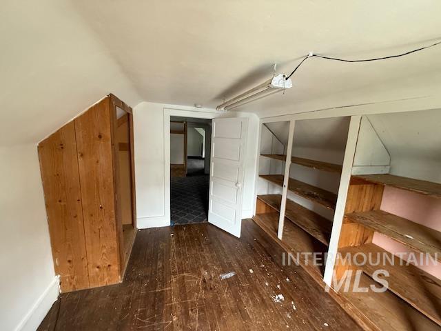 204 Front Street Kooskia, ID 83539 - Photo 18 of 25 Bonus room featuring dark wood-style flooring and vaulted ceiling