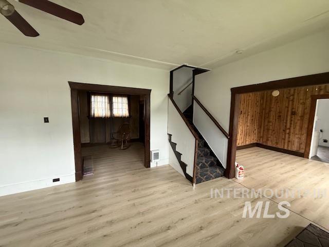 204 Front Street Kooskia, ID 83539 - Photo 8 of 25 Empty room with light wood-type flooring and stairs