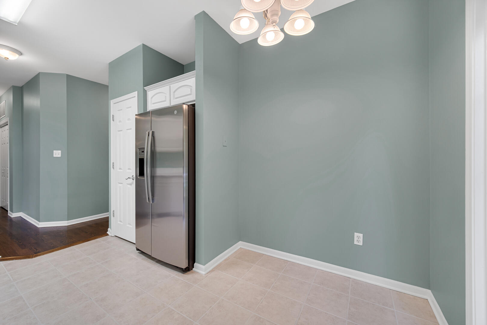 902 Boxwood Drive Munster, IN 46321 - Photo 11 of 23 a view of an empty room with a chandelier