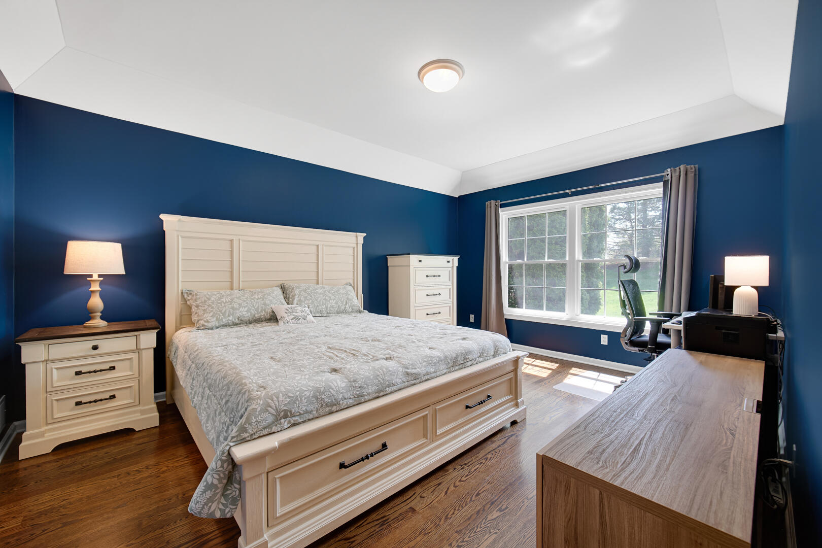 902 Boxwood Drive Munster, IN 46321 - Photo 15 of 23 a bedroom with a bed and wooden floor
