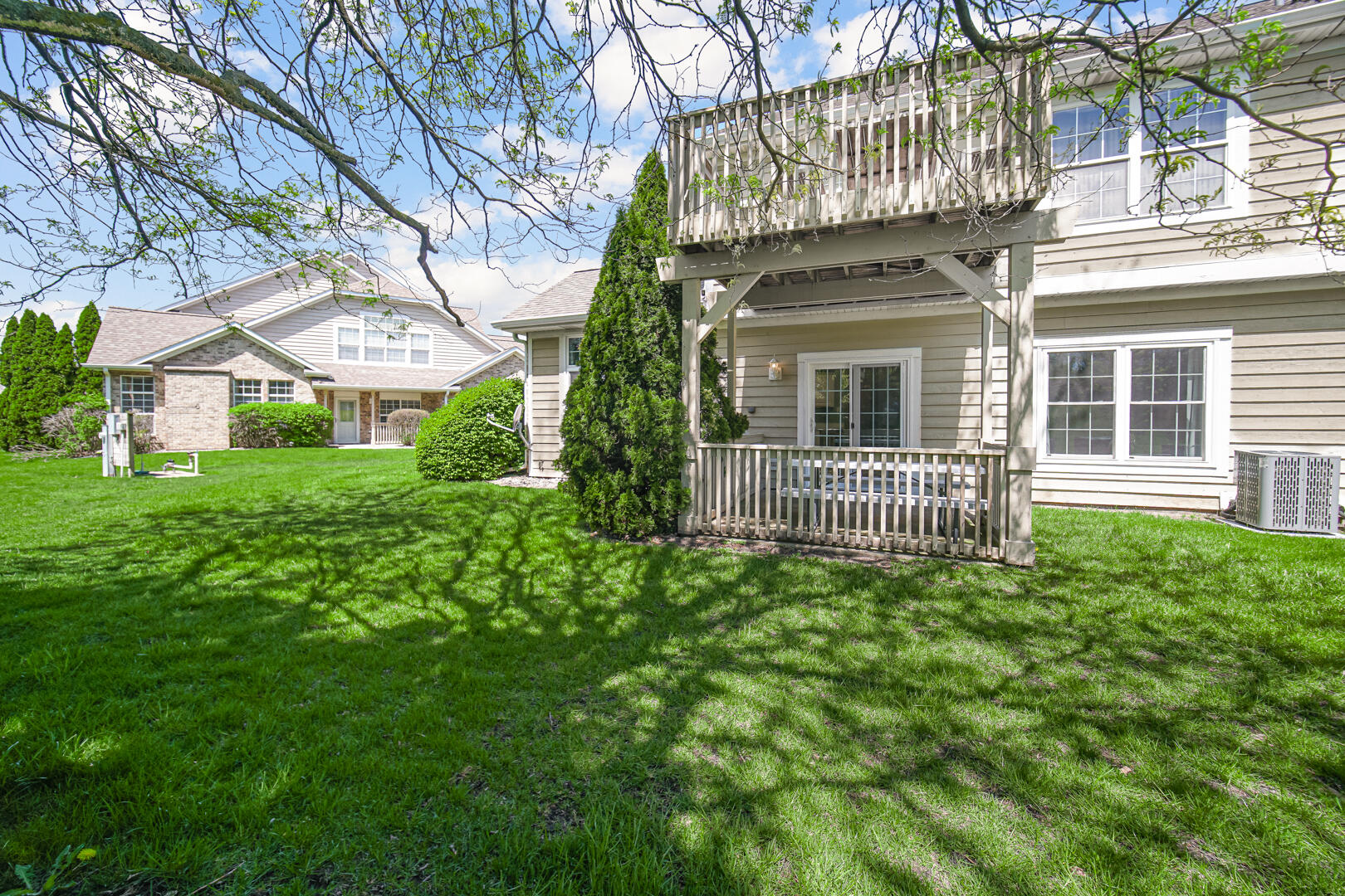 902 Boxwood Drive Munster, IN 46321 - Photo 20 of 23 a view of a house with a small yard and a large tree