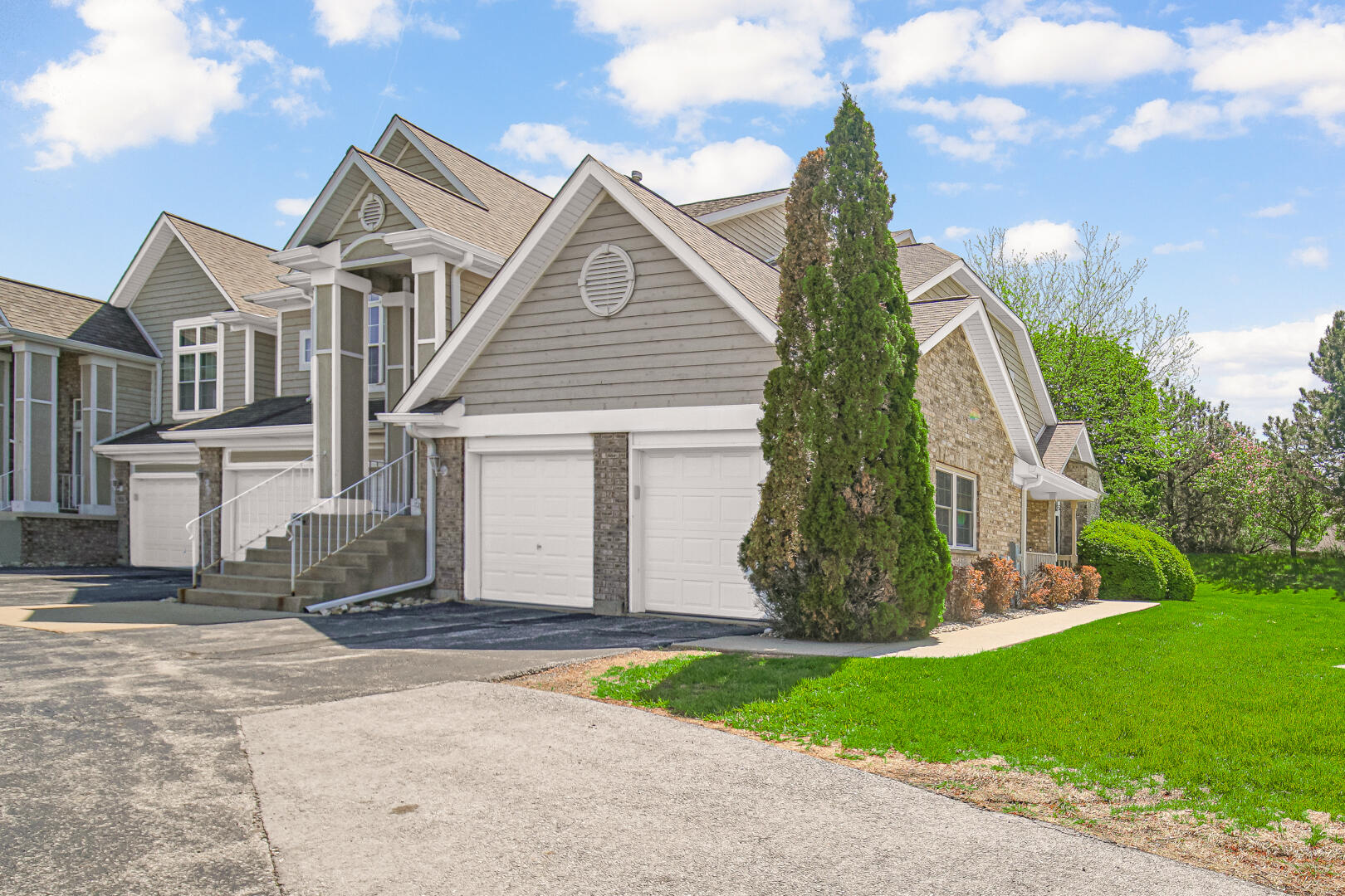 902 Boxwood Drive Munster, IN 46321 - Photo 2 of 23 a front view of a house with a yard and garage