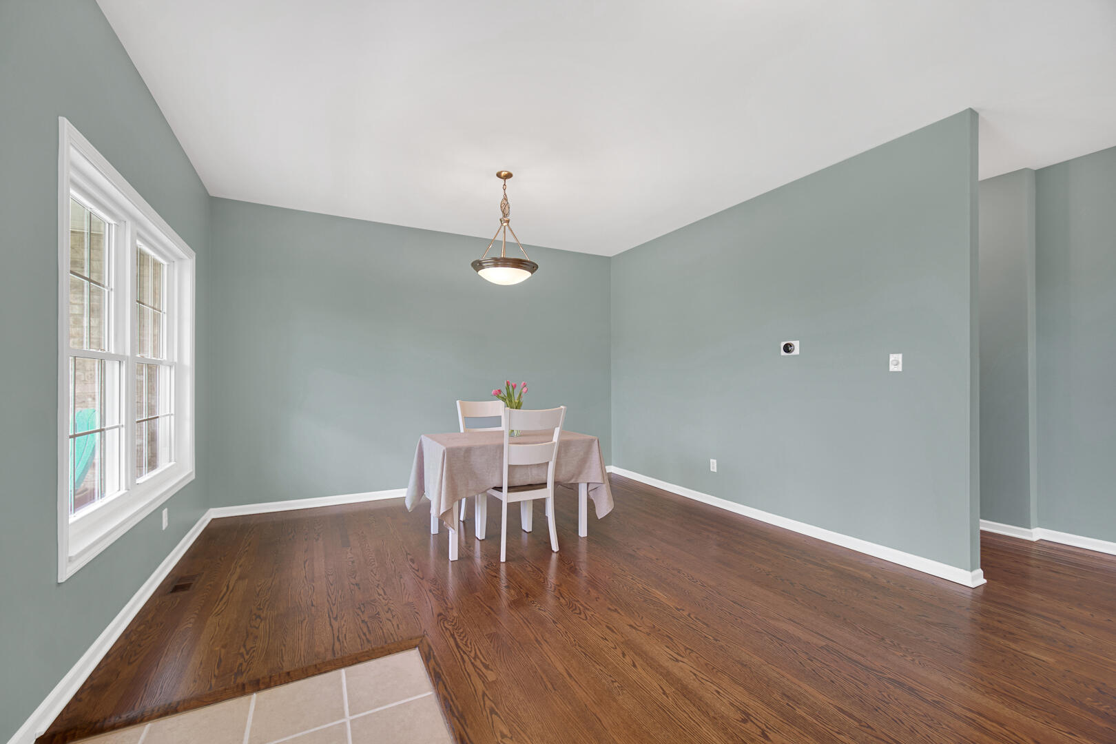 902 Boxwood Drive Munster, IN 46321 - Photo 6 of 23 a view of a dining room with furniture and wooden floor