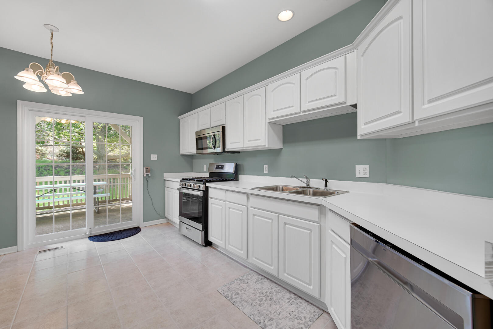902 Boxwood Drive Munster, IN 46321 - Photo 8 of 23 a kitchen with a sink cabinets appliances and a window