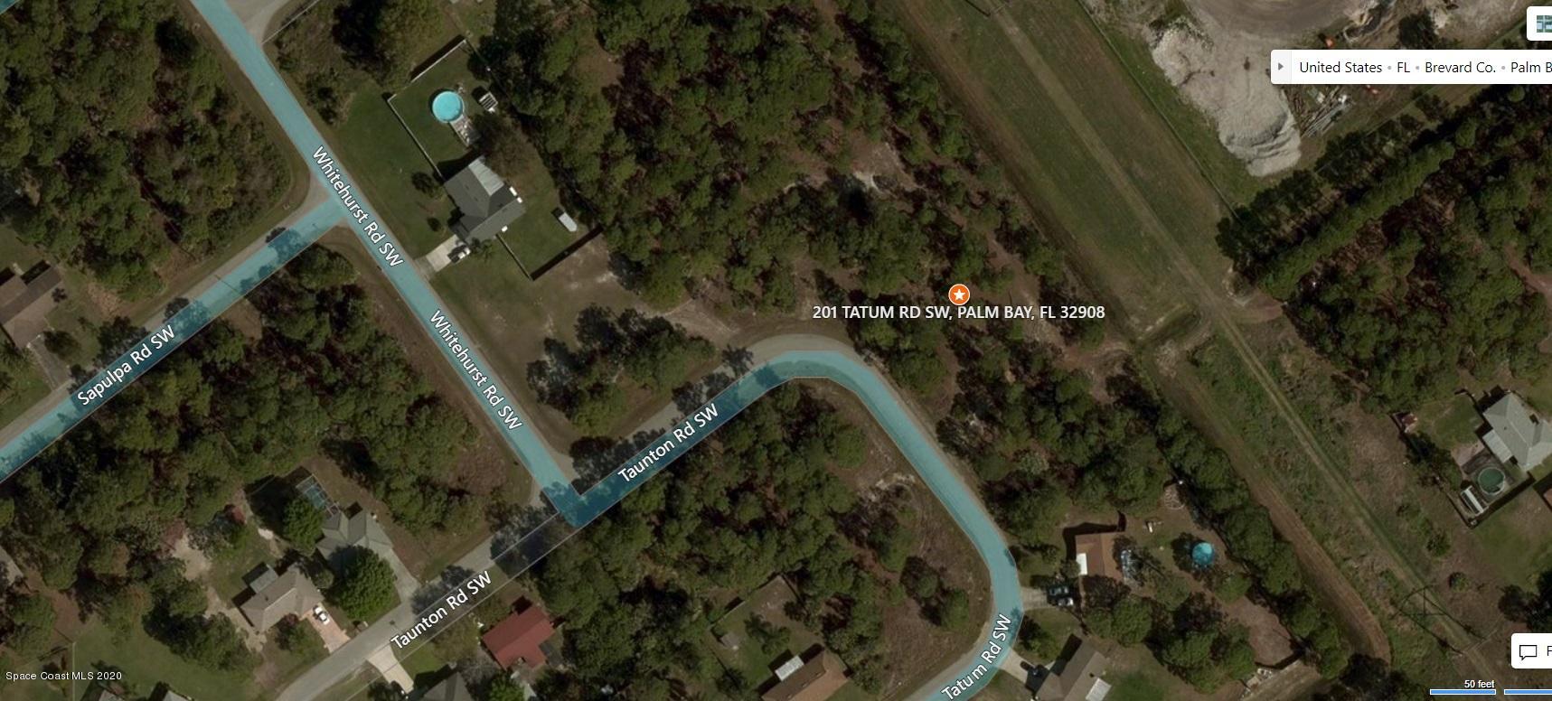 201 Tatum Road Southwest Palm Bay, FL 32908 - Photo 5 of 7 a view of a house with a yard