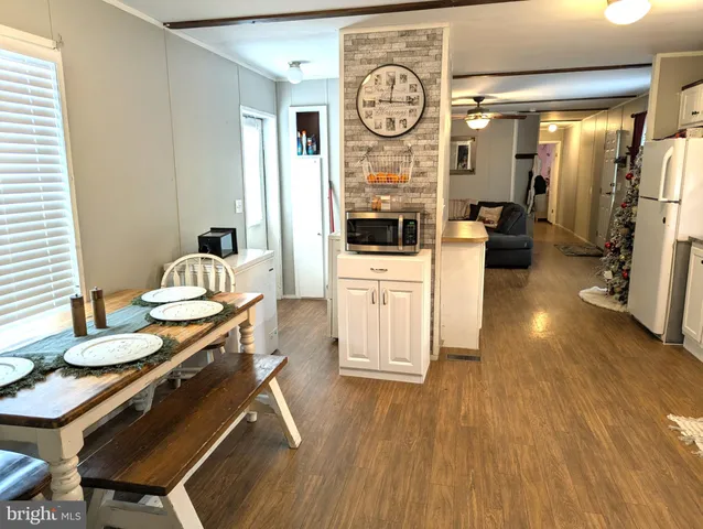 a living room with furniture and a clock