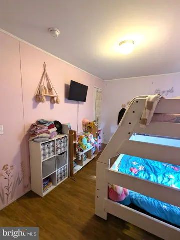 a bathroom with a sink mirror and toilet