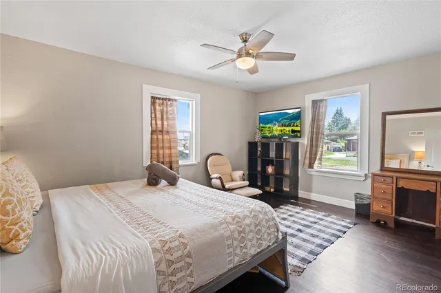 a bedroom with a bed furniture and a window