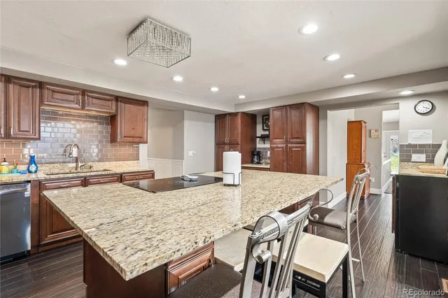 a kitchen with a table and chairs in it