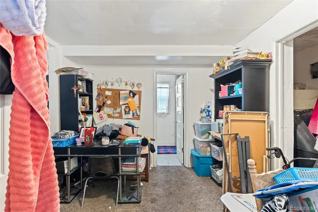 a view of a dining room with furniture and closet