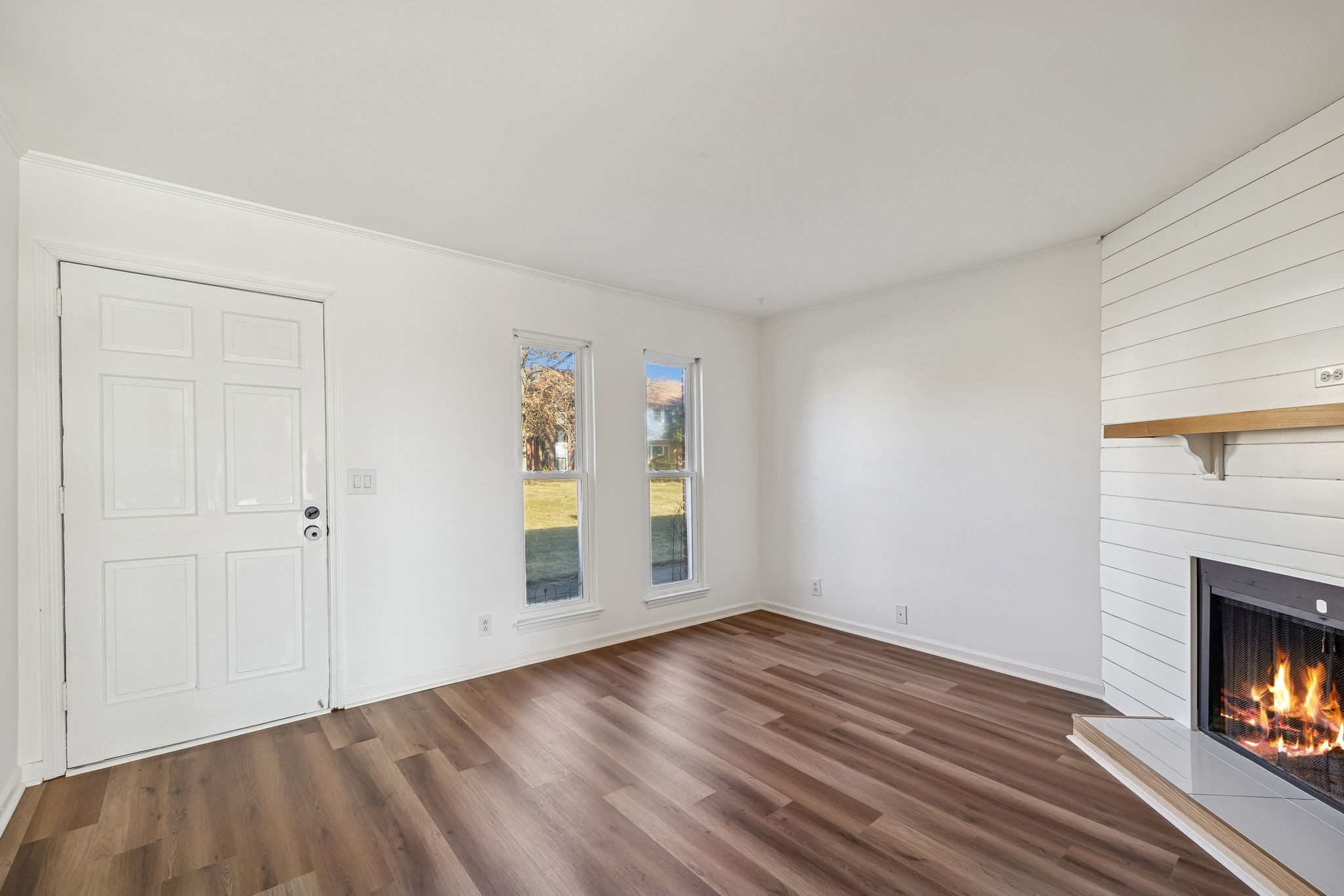 313 Huntington Ridge Drive Nashville, TN 37211 - Photo 10 of 48 a view of an empty room with wooden floor fireplace and a window