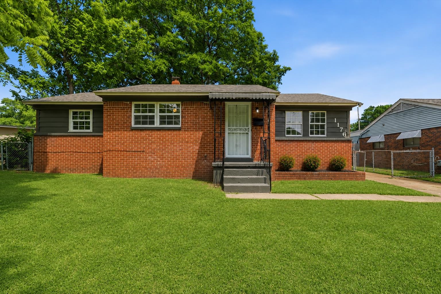 1176 South White Station Road Memphis, TN 38117 - Photo 2 of 15 Brick exterior with dark gray siding accents