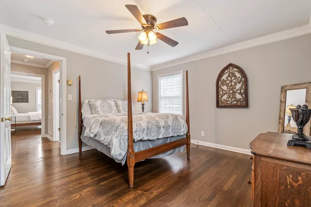 a bedroom with a bed and a table in it