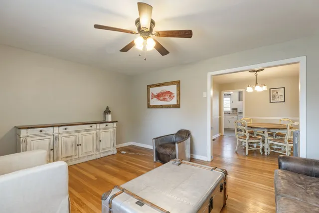 a bedroom with furniture and wooden floor